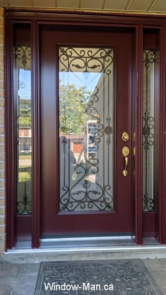 Front entry door replacement. Burgundy color. Two matching sidelights. Port Stanly wrought iron design
